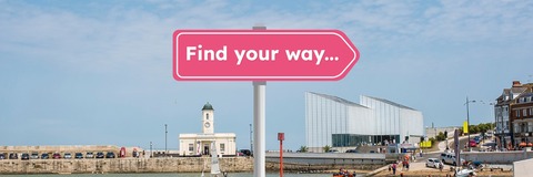 Bright pink arrow sign with white text reading "Find your way..." overlaid on a colour photographic scene featuring Margate harbour, Droit House, and Turner Contemporary.
